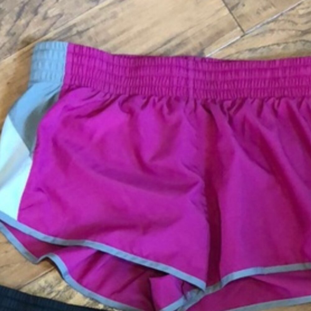 Women’s Nike running shorts Pink/Gray pair. size large.